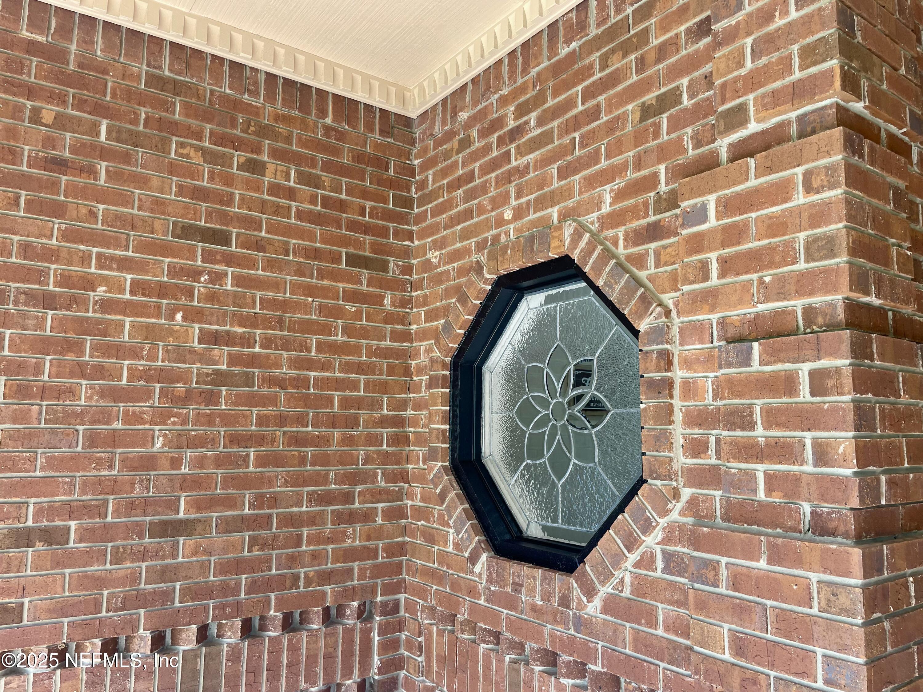 1168 Copper Gate Place Macclenny, FL 32063 - Photo 29 of 51 a view of a brick wall