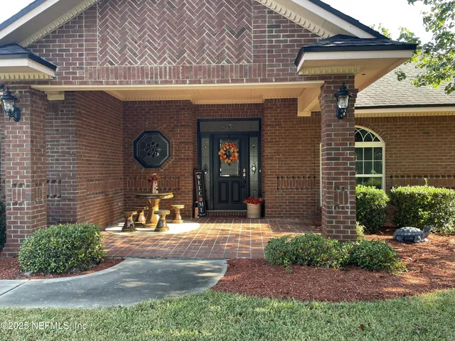 a front view of a house with garden