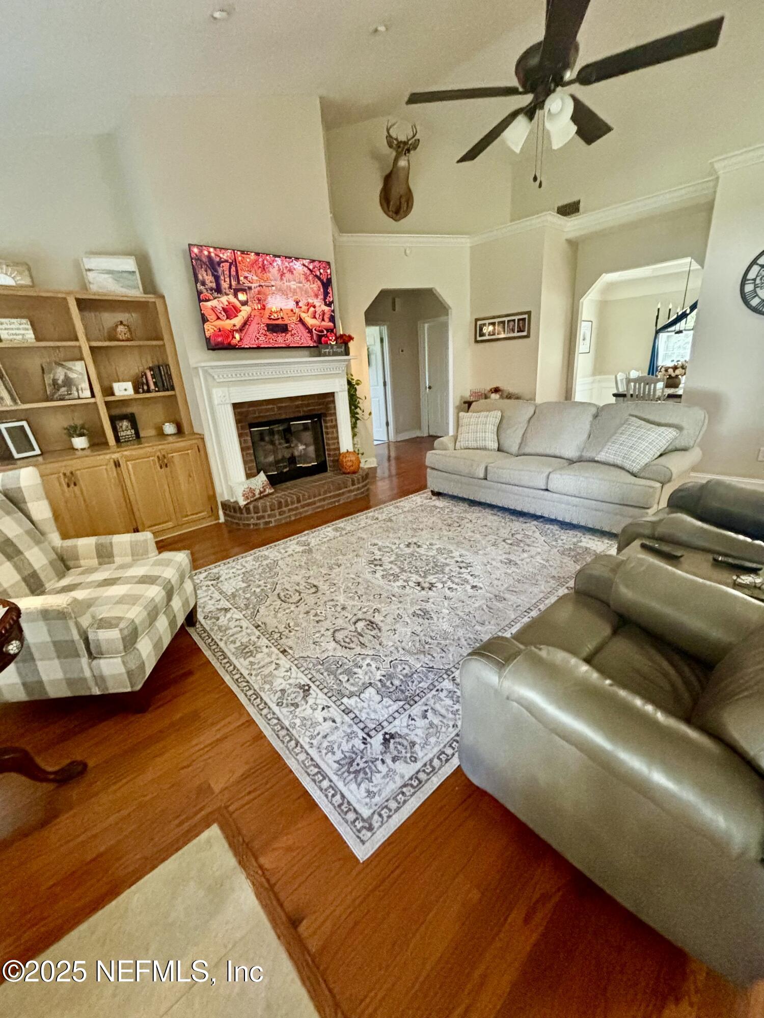 1168 Copper Gate Place Macclenny, FL 32063 - Photo 36 of 51 a living room with furniture and a fireplace