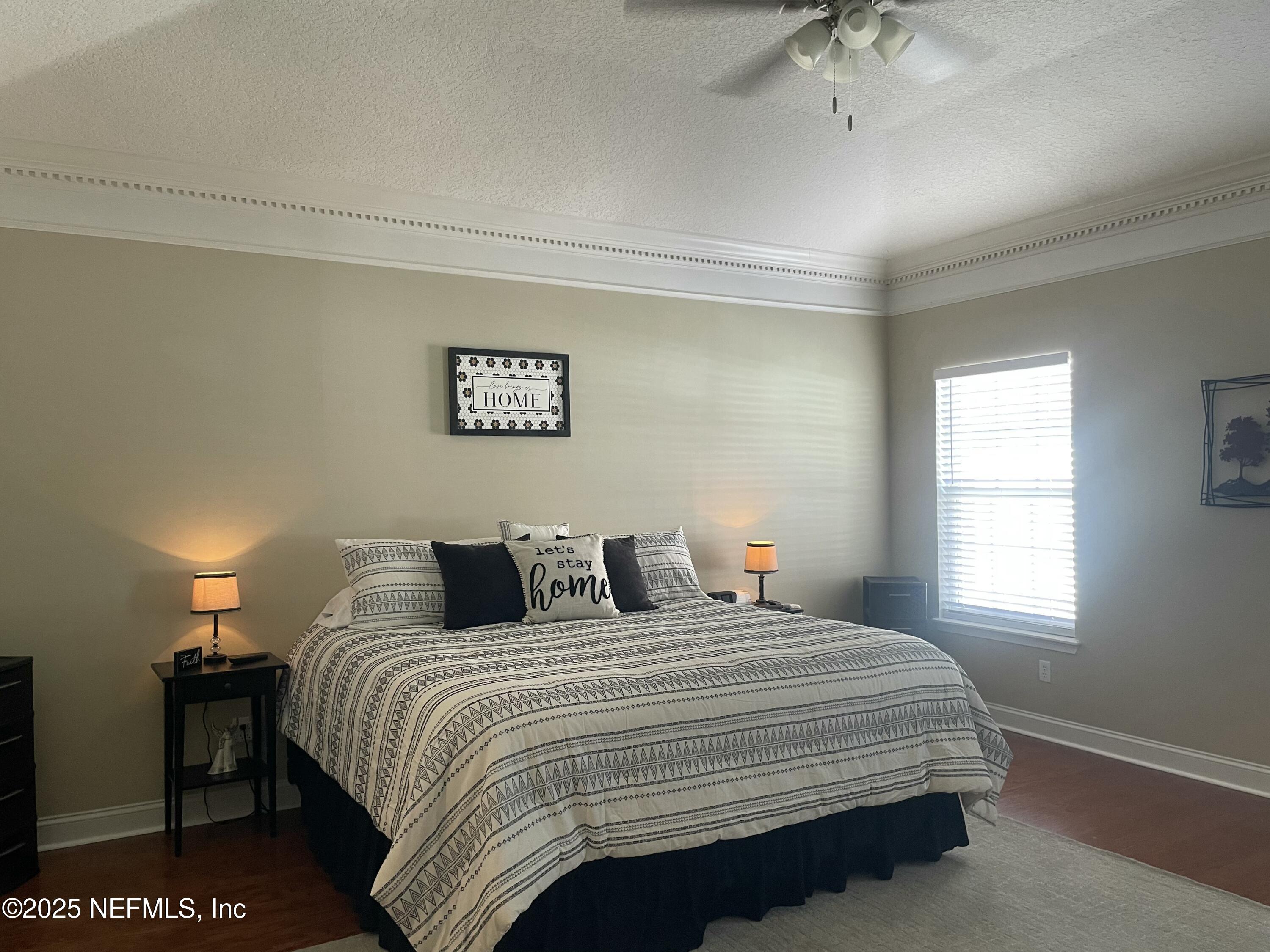 1168 Copper Gate Place Macclenny, FL 32063 - Photo 38 of 51 a bedroom with a bed and a window