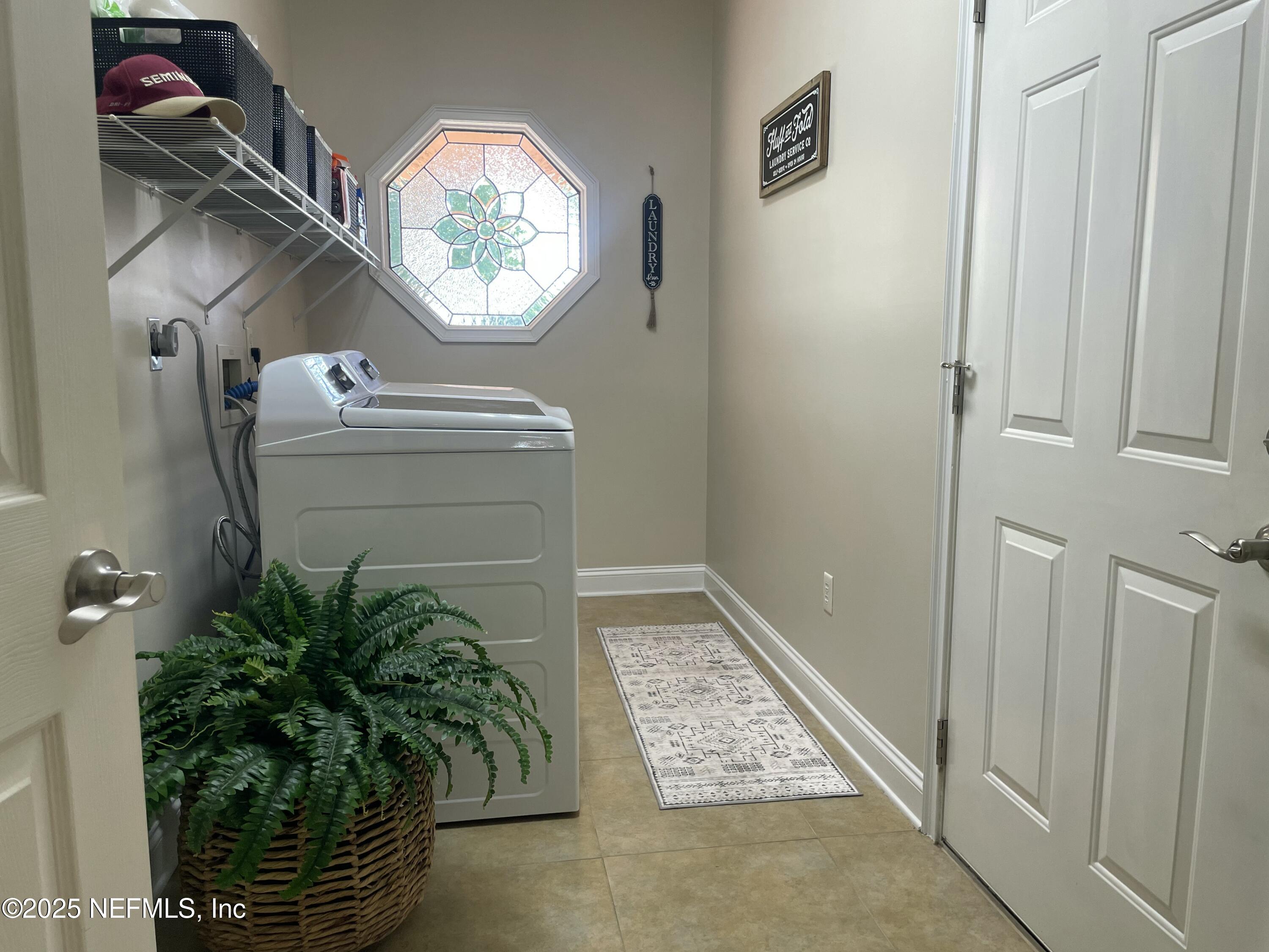 1168 Copper Gate Place Macclenny, FL 32063 - Photo 38 of 44 a bathroom with a sink and a mirror