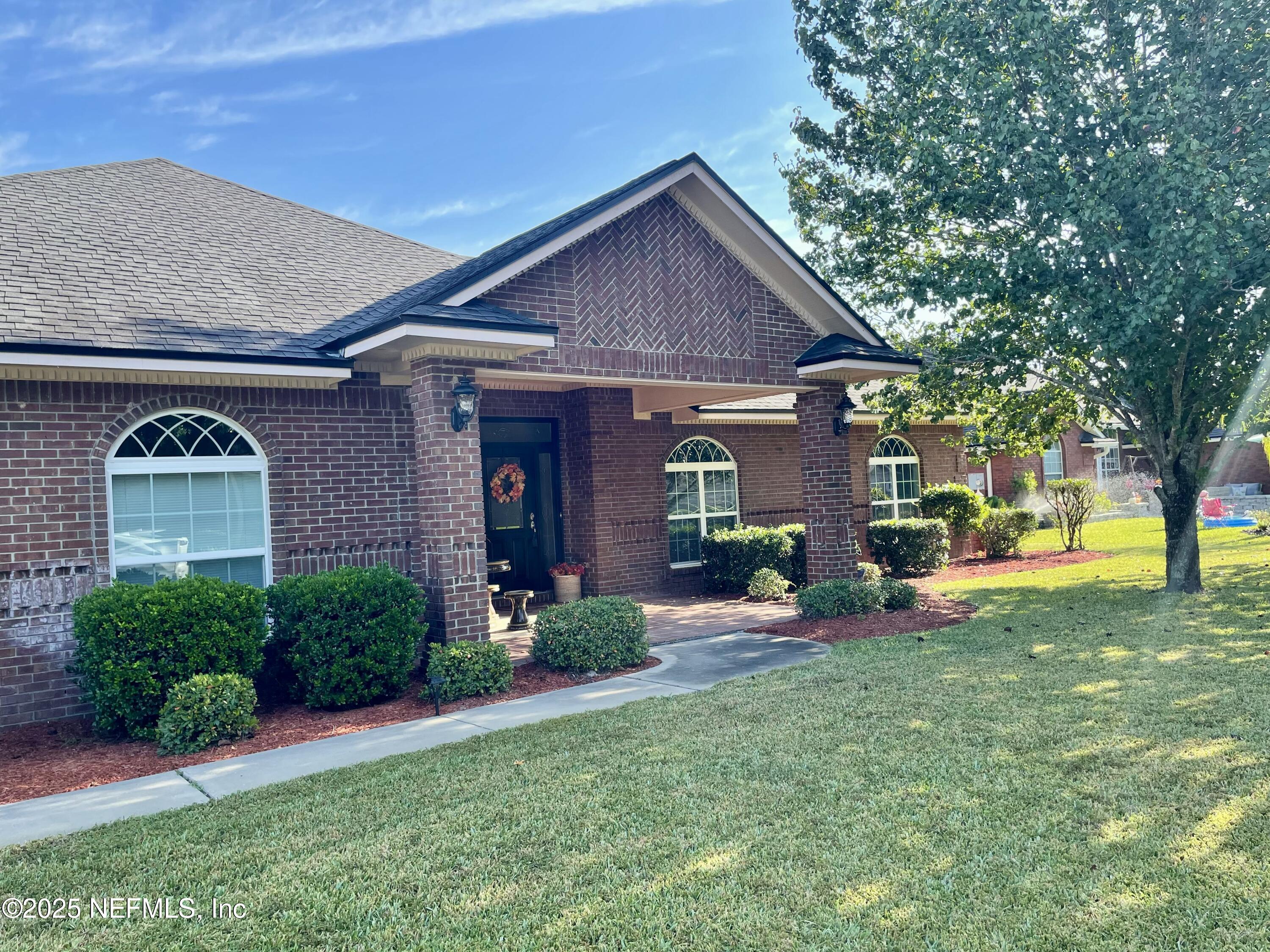 1168 Copper Gate Place Macclenny, FL 32063 - Photo 4 of 44 a front view of a house with garden