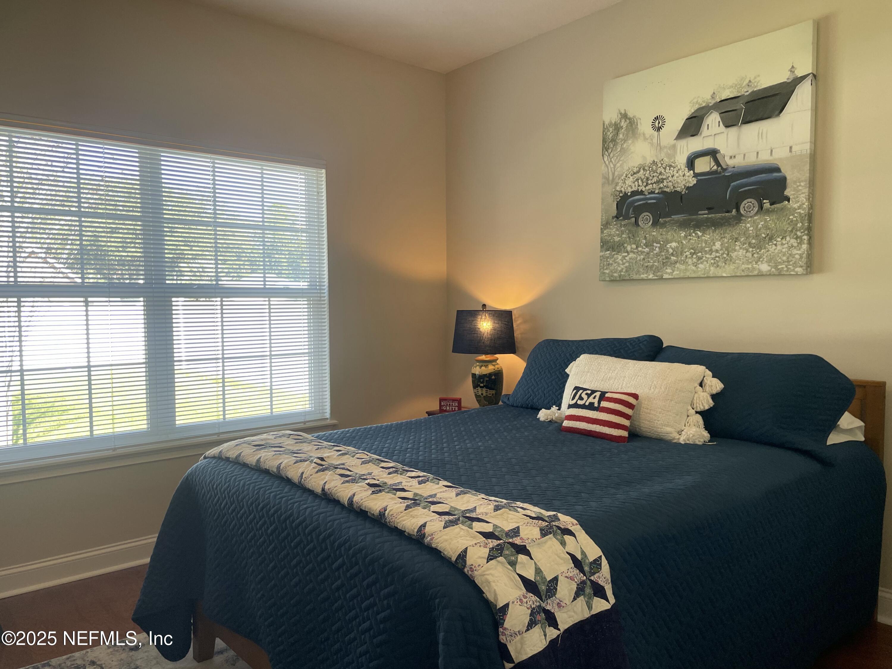 1168 Copper Gate Place Macclenny, FL 32063 - Photo 41 of 51 a bedroom with a bed and window