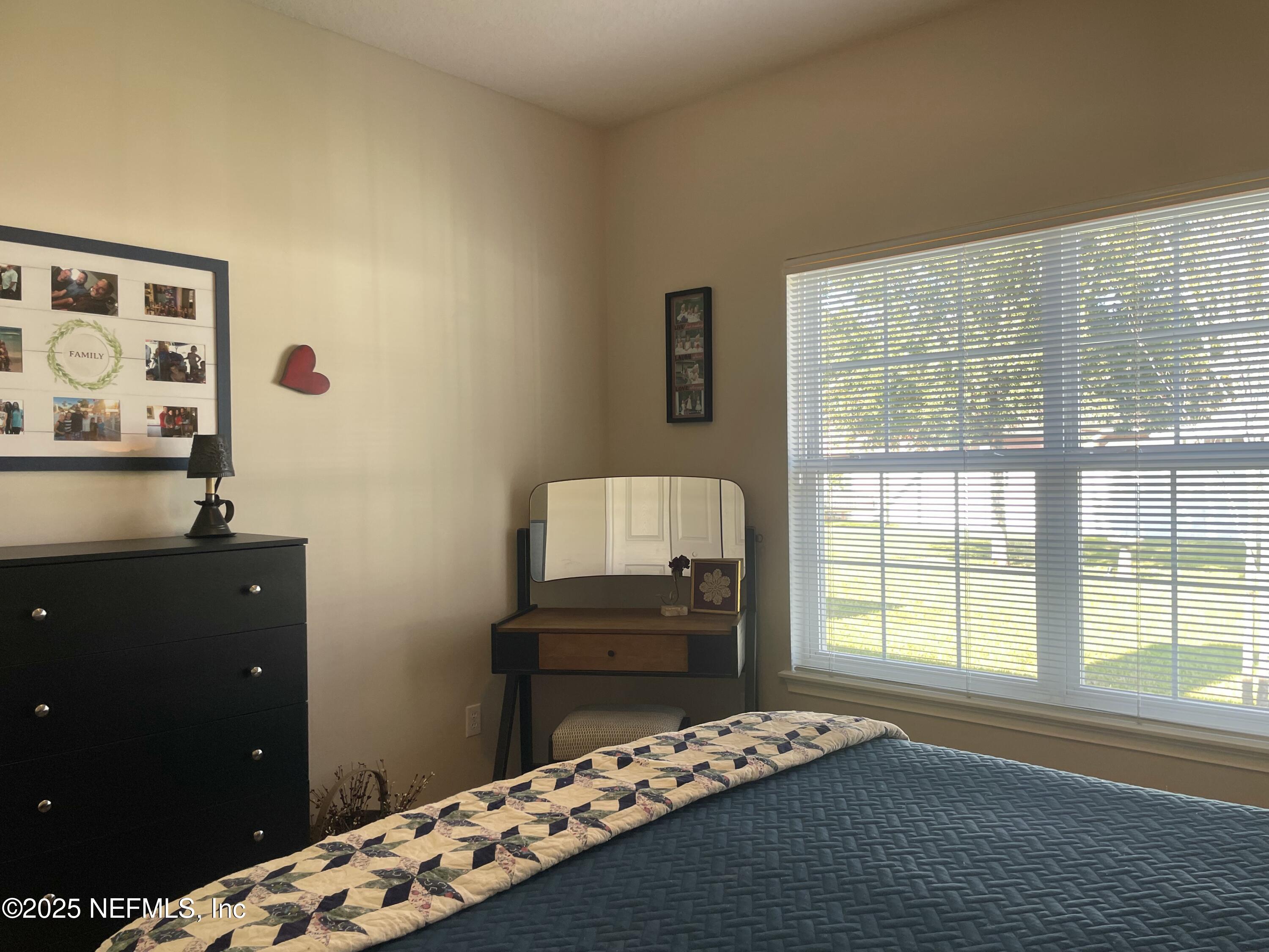 1168 Copper Gate Place Macclenny, FL 32063 - Photo 42 of 51 a bedroom with a bed and a window