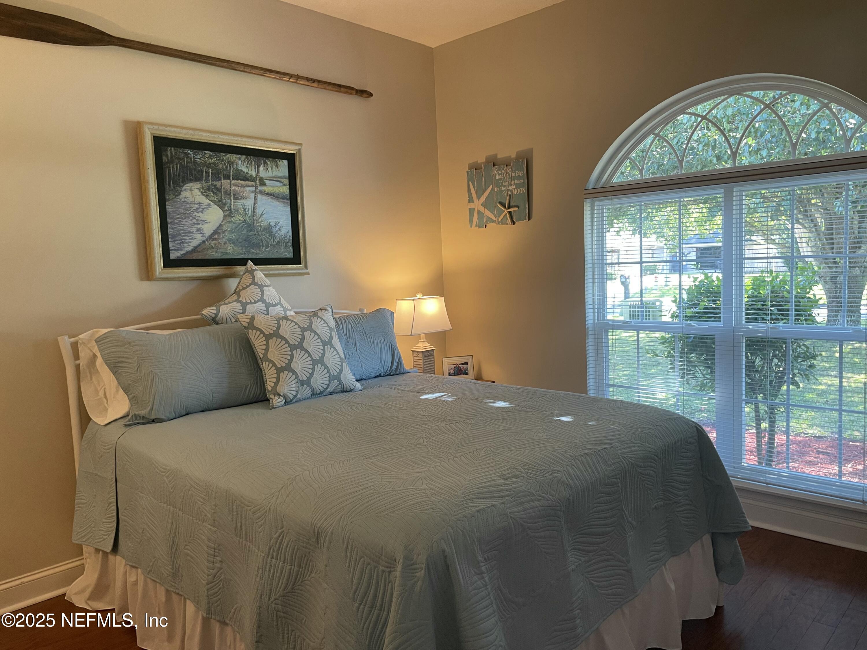 1168 Copper Gate Place Macclenny, FL 32063 - Photo 43 of 51 a bed sitting in a bedroom next to a window