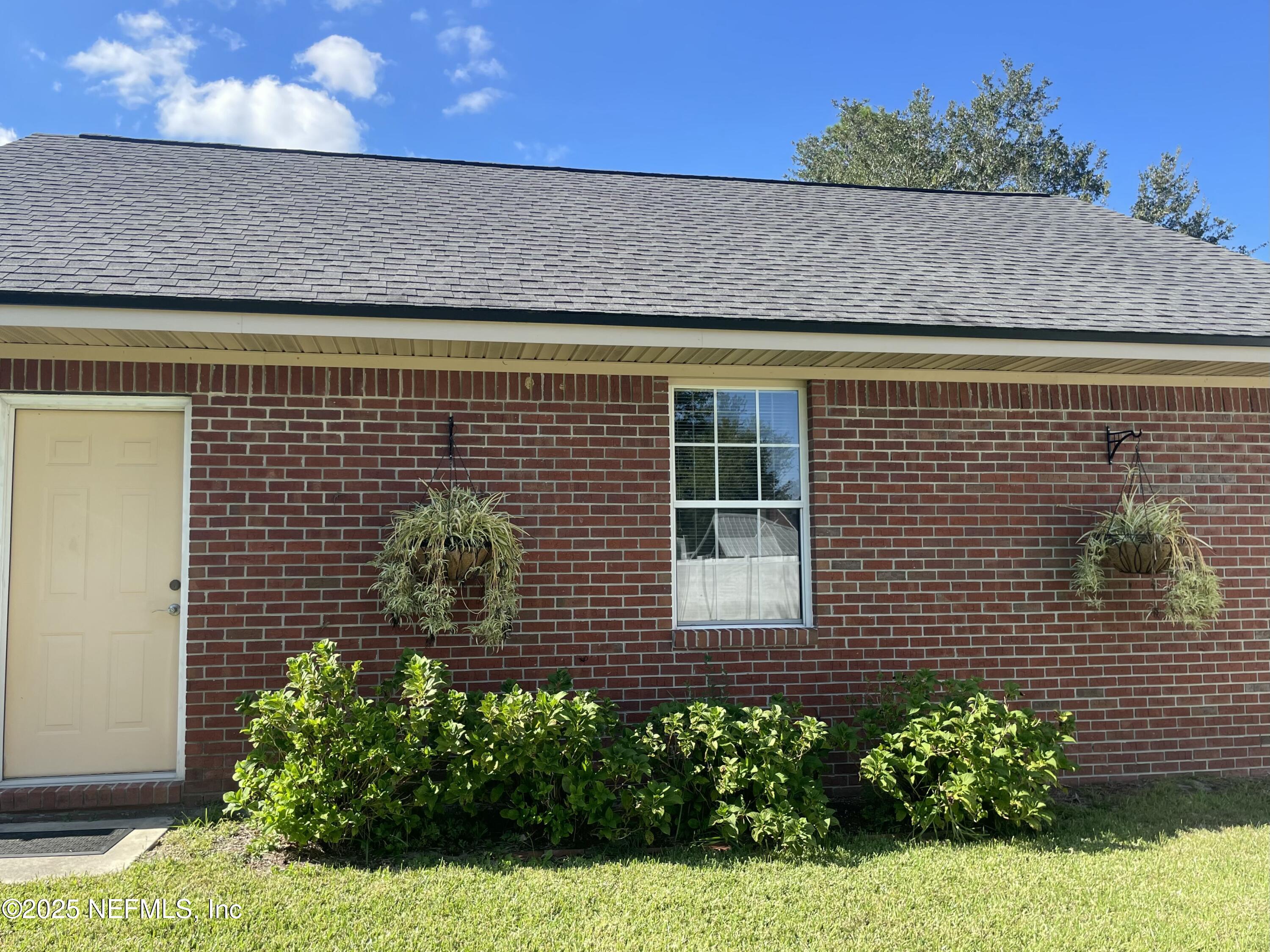 1168 Copper Gate Place Macclenny, FL 32063 - Photo 43 of 44 a view of a house with a yard