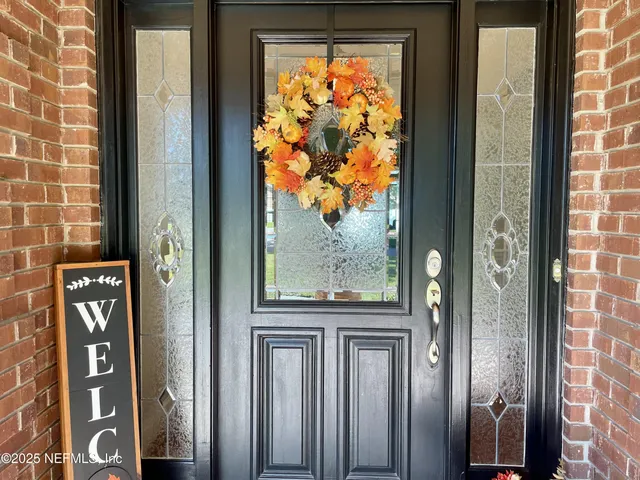 a view of a door and a window