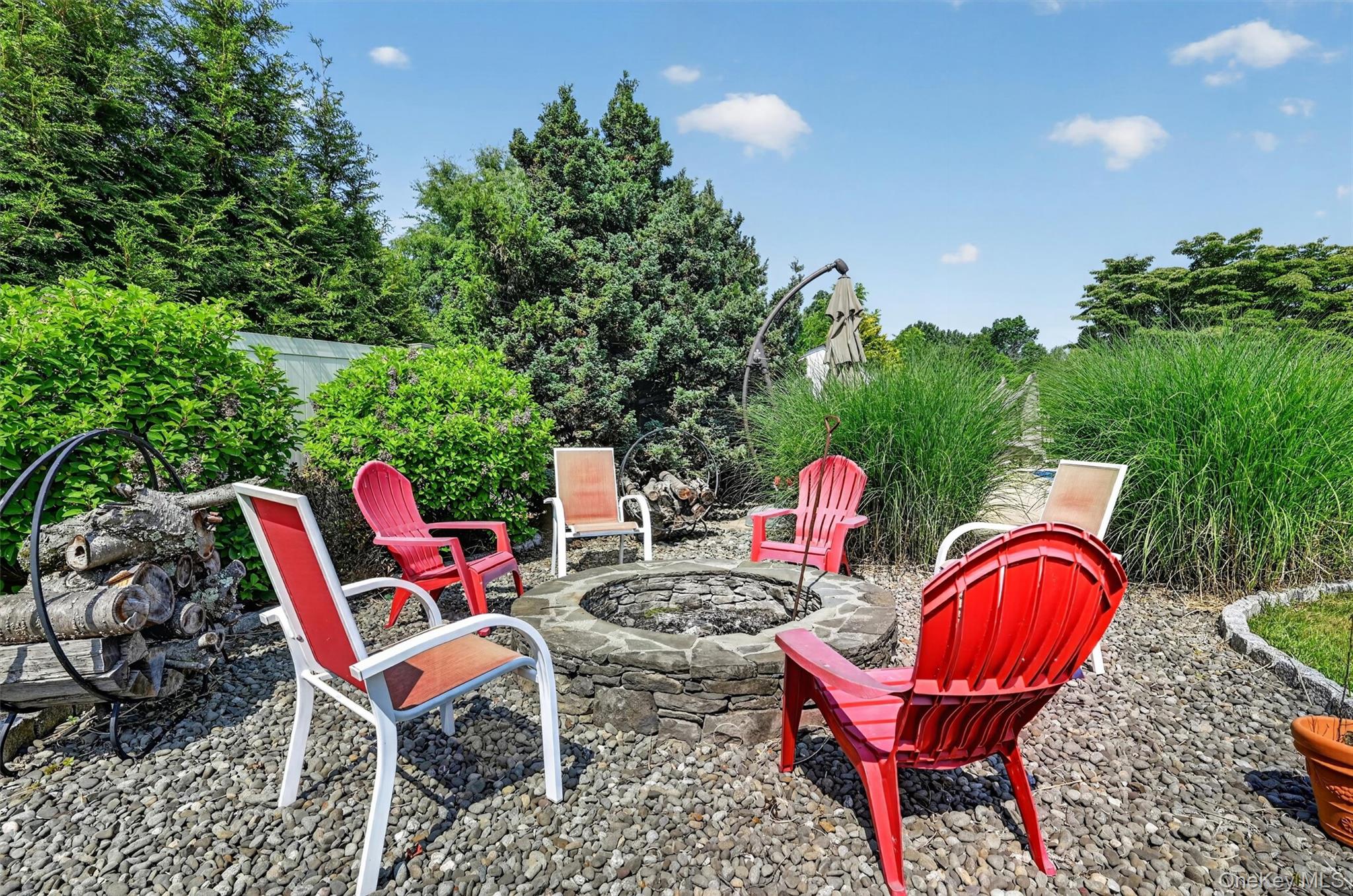 5 Hedges Road Warwick, NY 10990 - Photo 46 of 48 A dedicated firepit area adds another inviting spot to gather, unwind, and enjoy evenings outside.