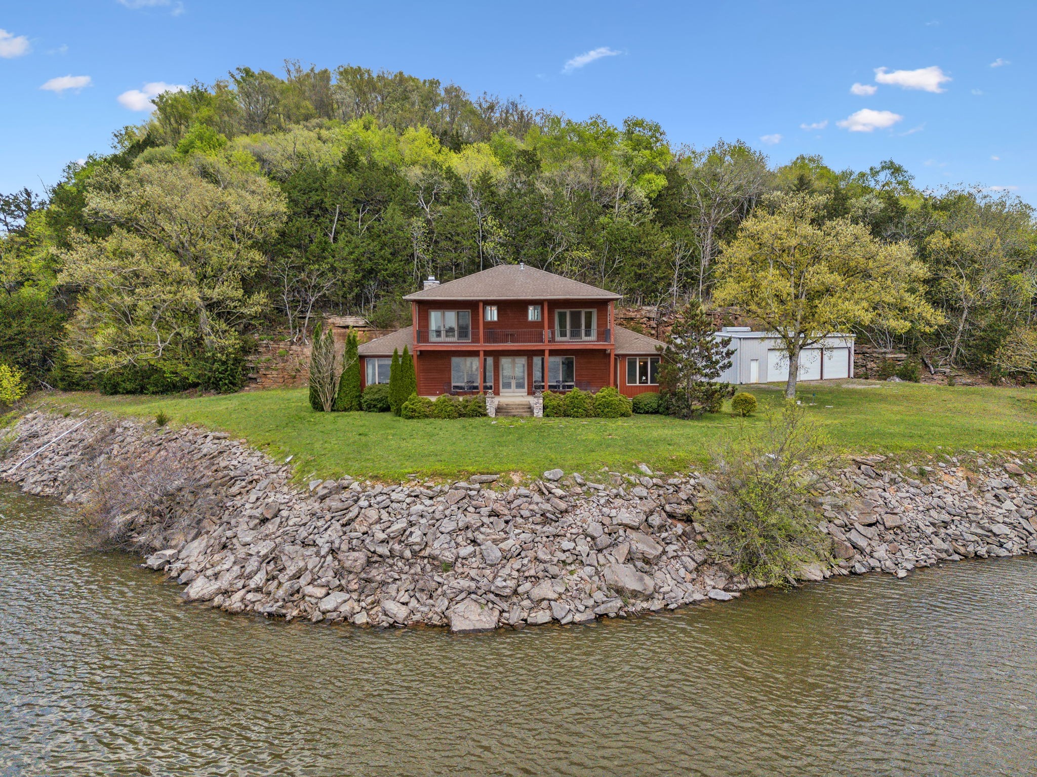 a view of a garden with a house in the background
