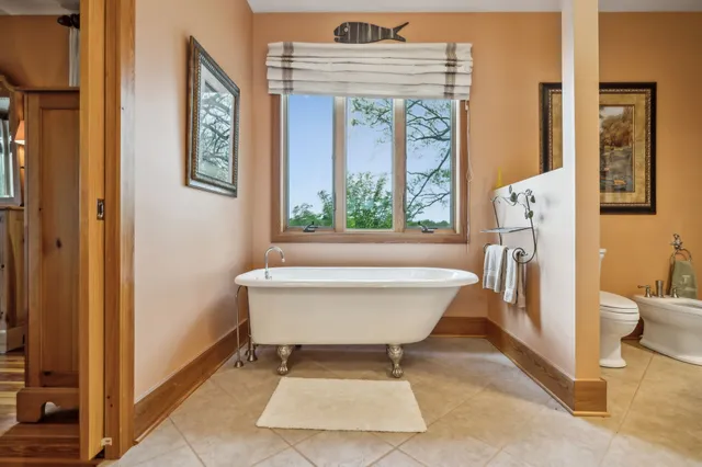 a living room with furniture wooden floor and a table