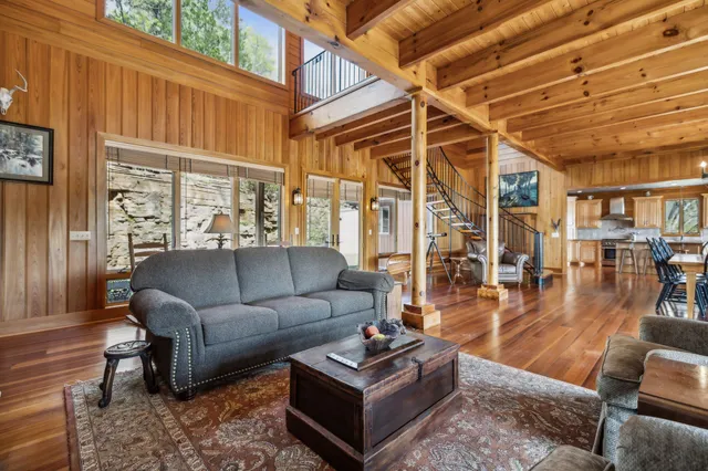 a view of a brick wall with a chair and wooden floor