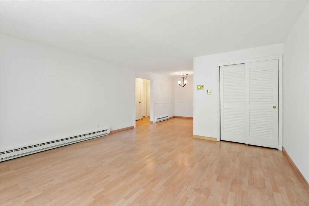 47 Will Drive, Unit 114 Canton, MA 02021 - Photo 19 of 25 a view of an empty room and wooden floor