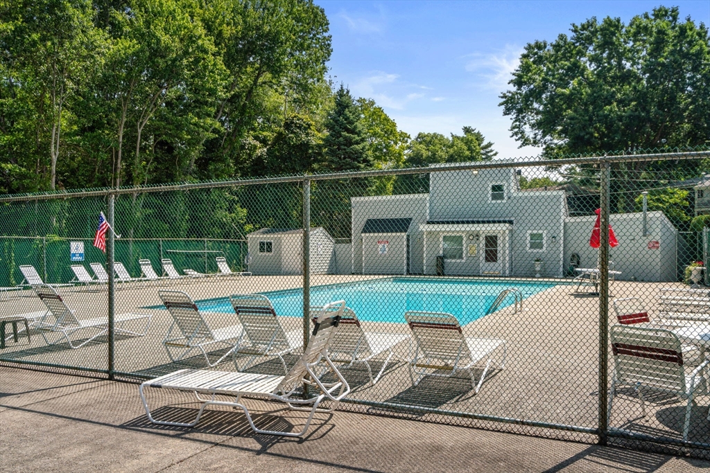 47 Will Drive, Unit 114 Canton, MA 02021 - Photo 23 of 25 a view of a house with backyard sitting area and garden