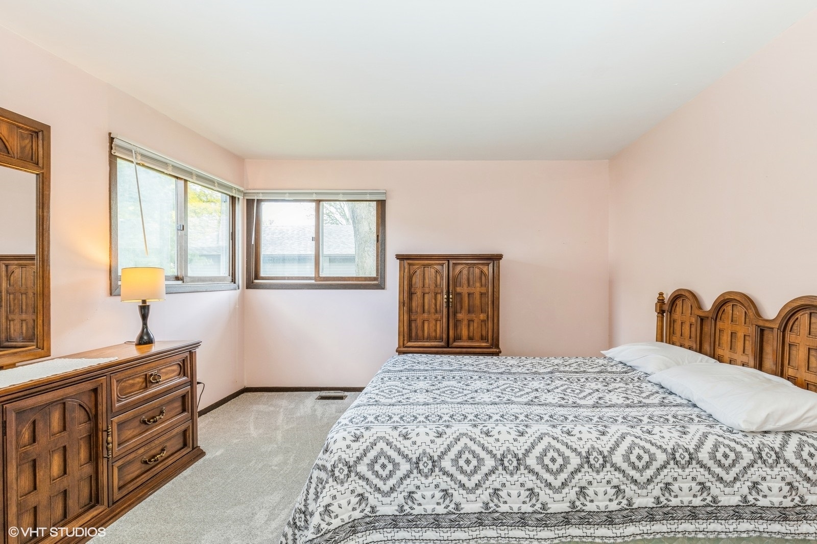 1214 Thomas Drive Woodstock, IL 60098 - Photo 9 of 14 a bedroom with a large bed and a dresser