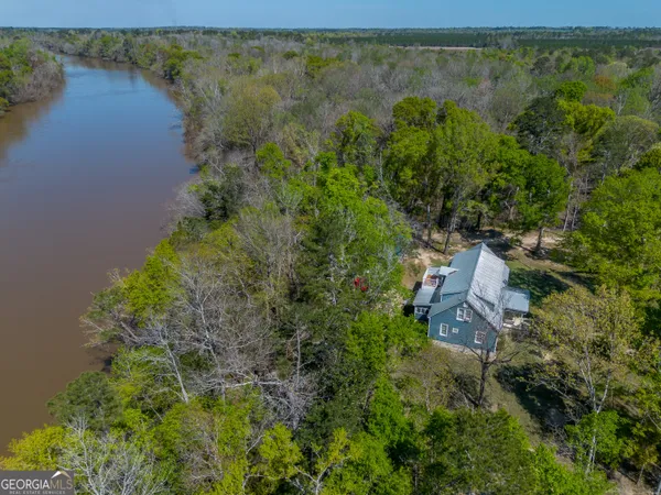 an aerial view of residential house with outdoor space and lake view