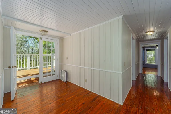 a view of a porch with wooden floor and outdoor space