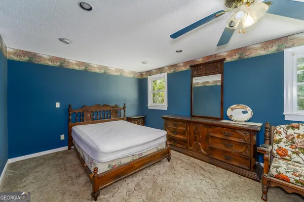 a view of a room with wooden walls