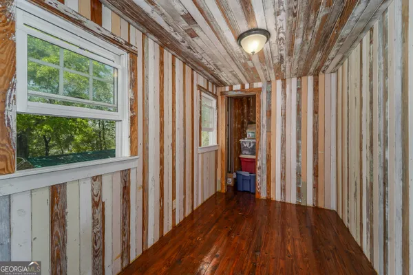 a room with natural light and wooden floor