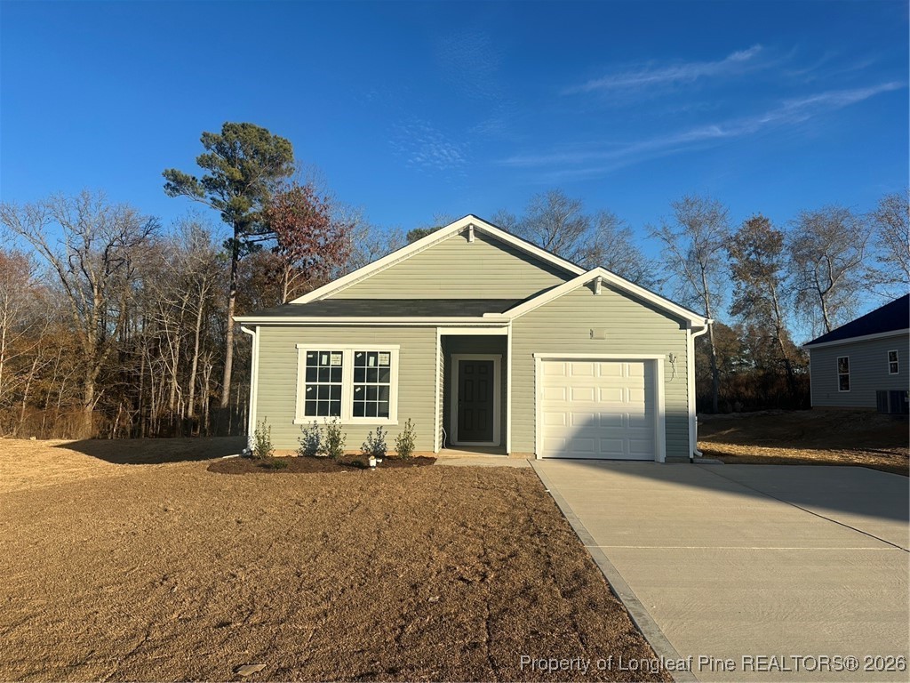 588 Wicklow Lane Raeford, NC 28376 - Photo 1 of 2 a front view of a house with a yard and garage