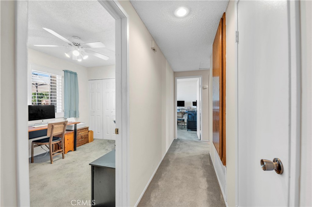 1114 Bottle Tree Way Hemet, CA 92545 - Photo 17 of 25 a view of a hallway with workspace and bathroom