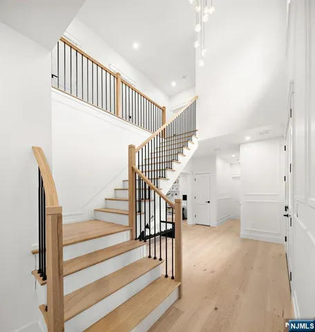 a view of staircase with white walls and a window