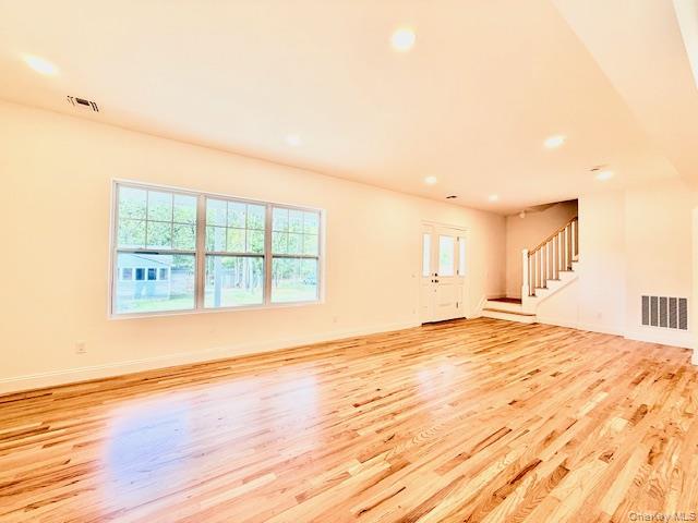 120 River Road Shirley, NY 11967 - Photo 12 of 27 a view of an empty room with wooden floor and a window