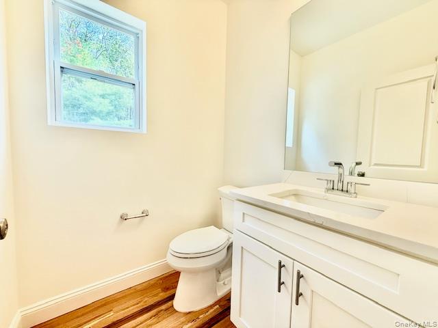 120 River Road Shirley, NY 11967 - Photo 13 of 27 a bathroom with a granite countertop sink mirror vanity and toilet