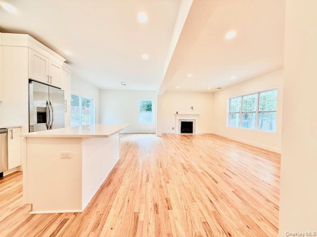 120 River Road Shirley, NY 11967 - Photo 14 of 27 a view of kitchen with granite countertop cabinets and wooden floor