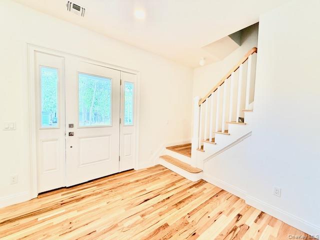 120 River Road Shirley, NY 11967 - Photo 15 of 27 a view of a bedroom with wooden floor and white walls