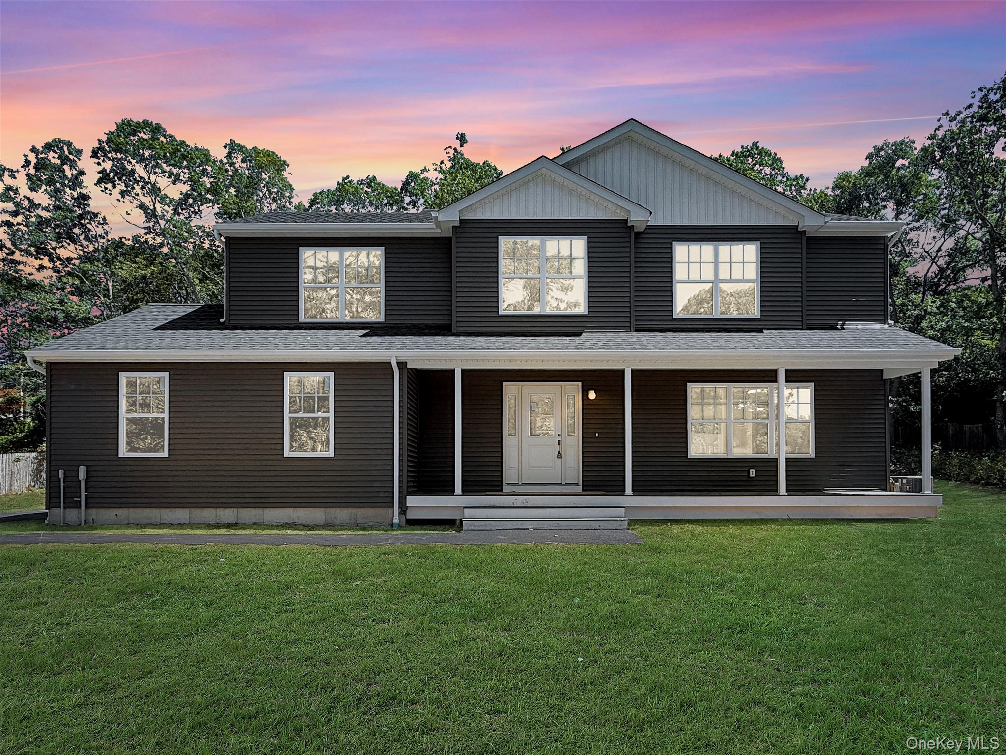 120 River Road Shirley, NY 11967 - Photo 2 of 27 a front view of a house with a yard