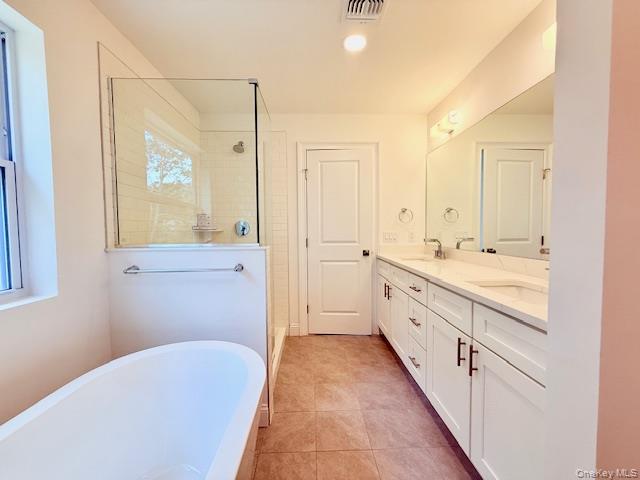 120 River Road Shirley, NY 11967 - Photo 24 of 27 a spacious bathroom with a tub sink and mirror