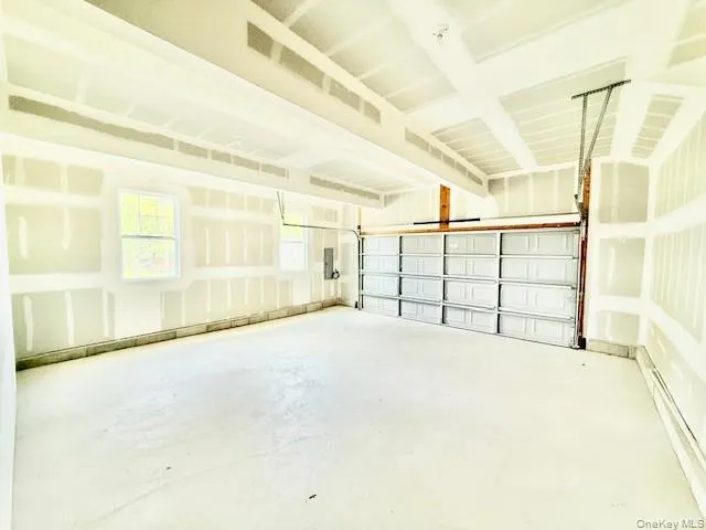 a view of empty room with windows