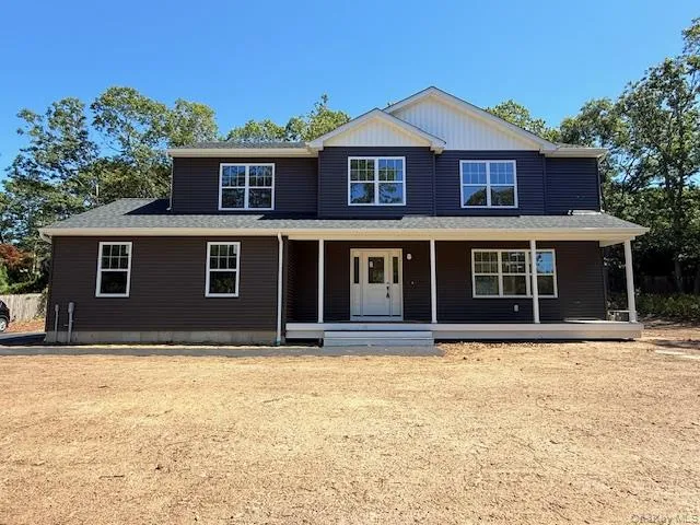 a house with trees in the background
