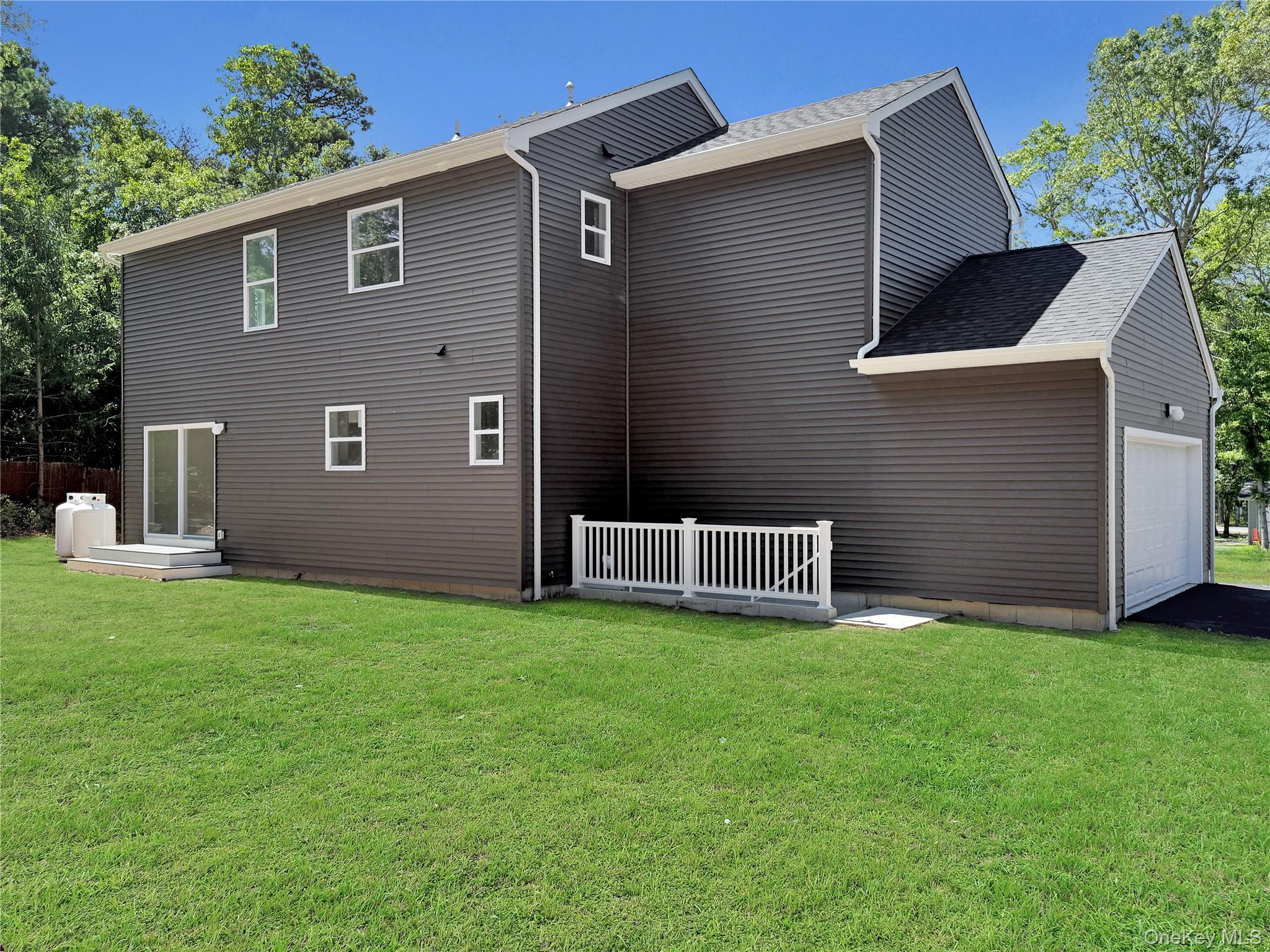 120 River Road Shirley, NY 11967 - Photo 5 of 27 a view of a house with backyard and garden