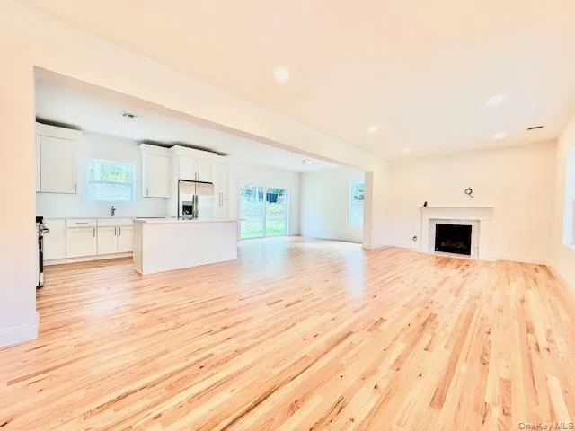 a large white bed in a white room
