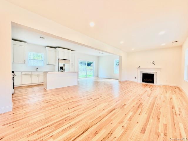 120 River Road Shirley, NY 11967 - Photo 8 of 27 a large white bed in a white room