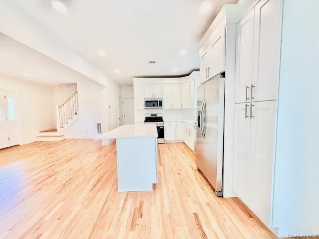 a view of kitchen with wooden floor