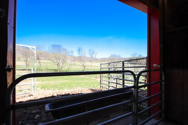 a kitchen with stainless steel appliances granite countertop a refrigerator a sink a stove and white cabinets