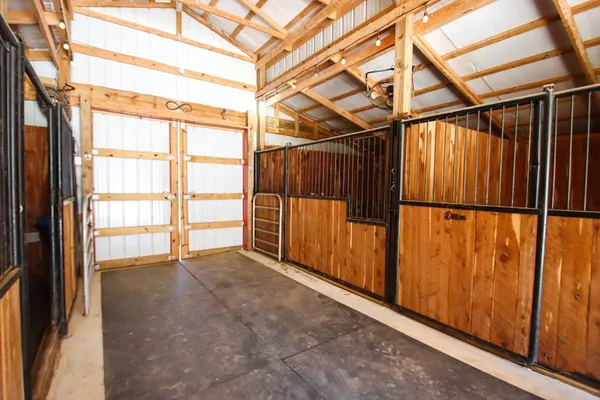 a kitchen with stainless steel appliances granite countertop a sink dishwasher stove and oven with wooden floor