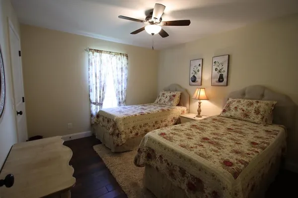 a view of a house with fountain and floor to ceiling windows