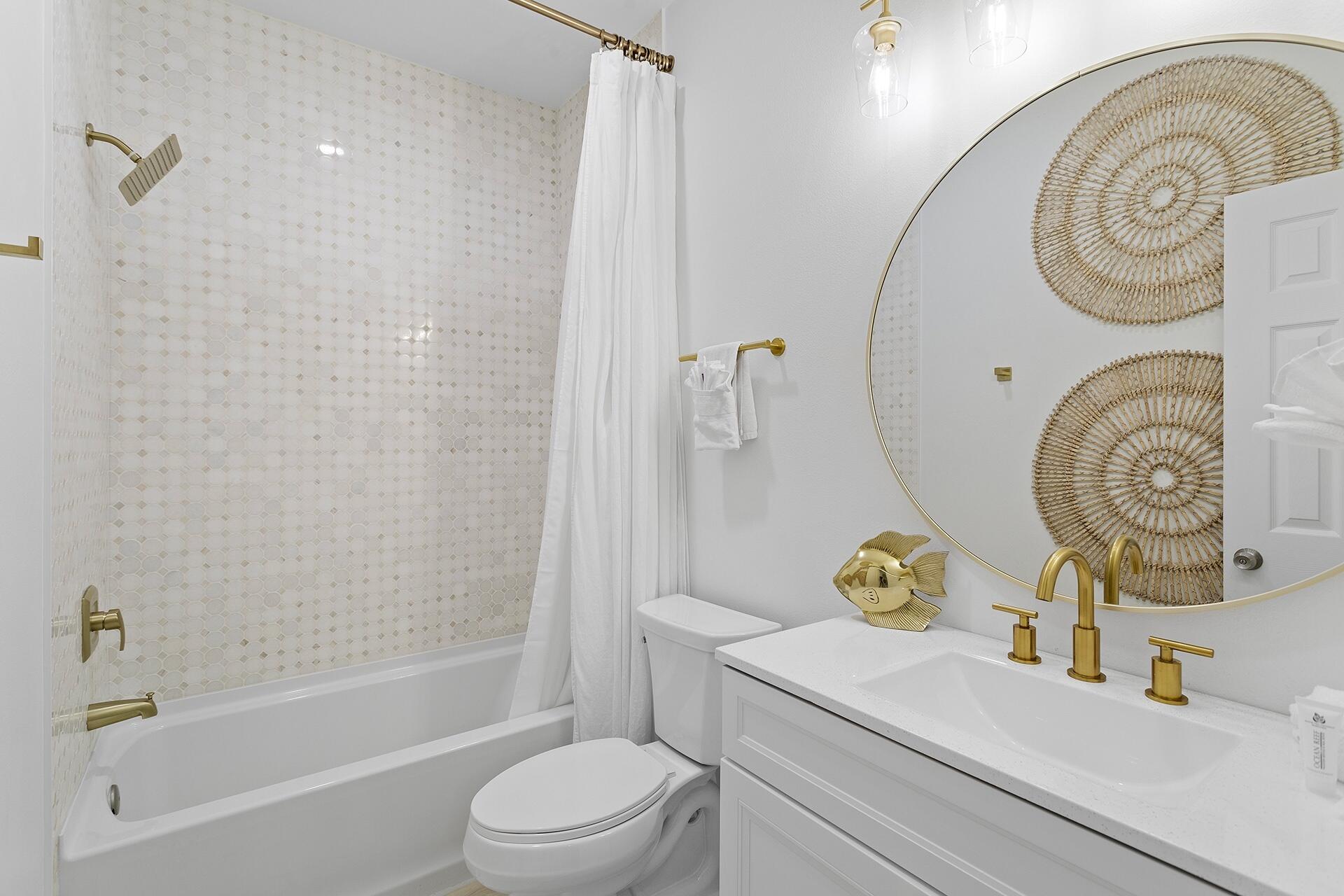53 Gulfside Way Miramar Beach, FL 32550 - Photo 13 of 34 a bathroom with a sink mirror toilet and bathtub