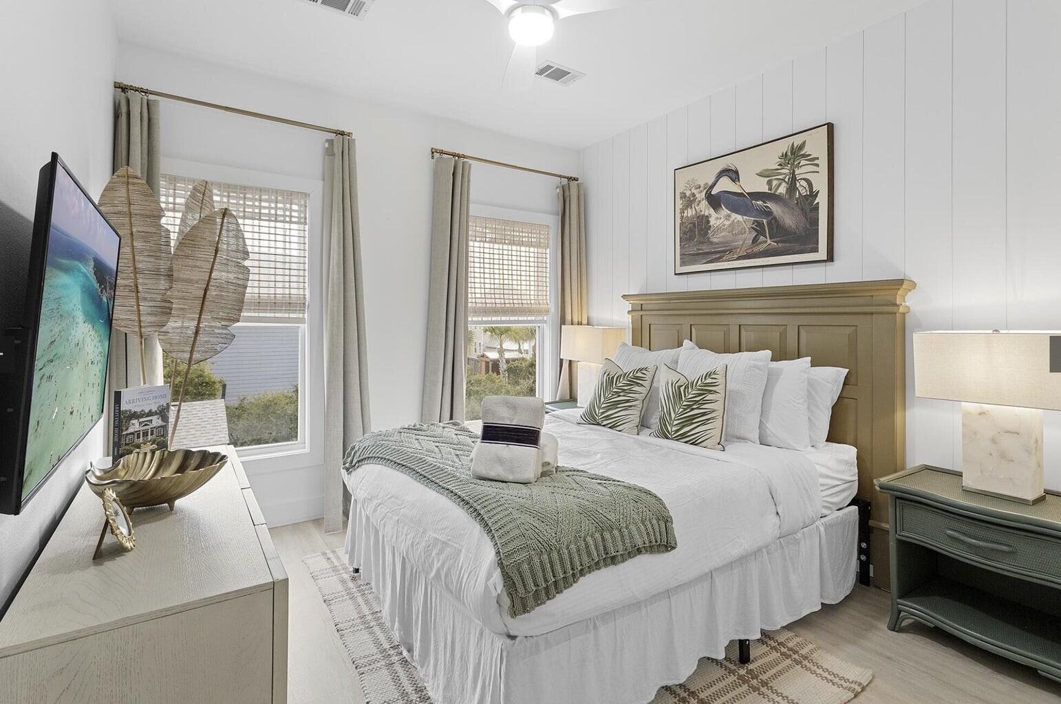 53 Gulfside Way Miramar Beach, FL 32550 - Photo 16 of 34 a bedroom with bed a flat tv screen and a large window with the outer view