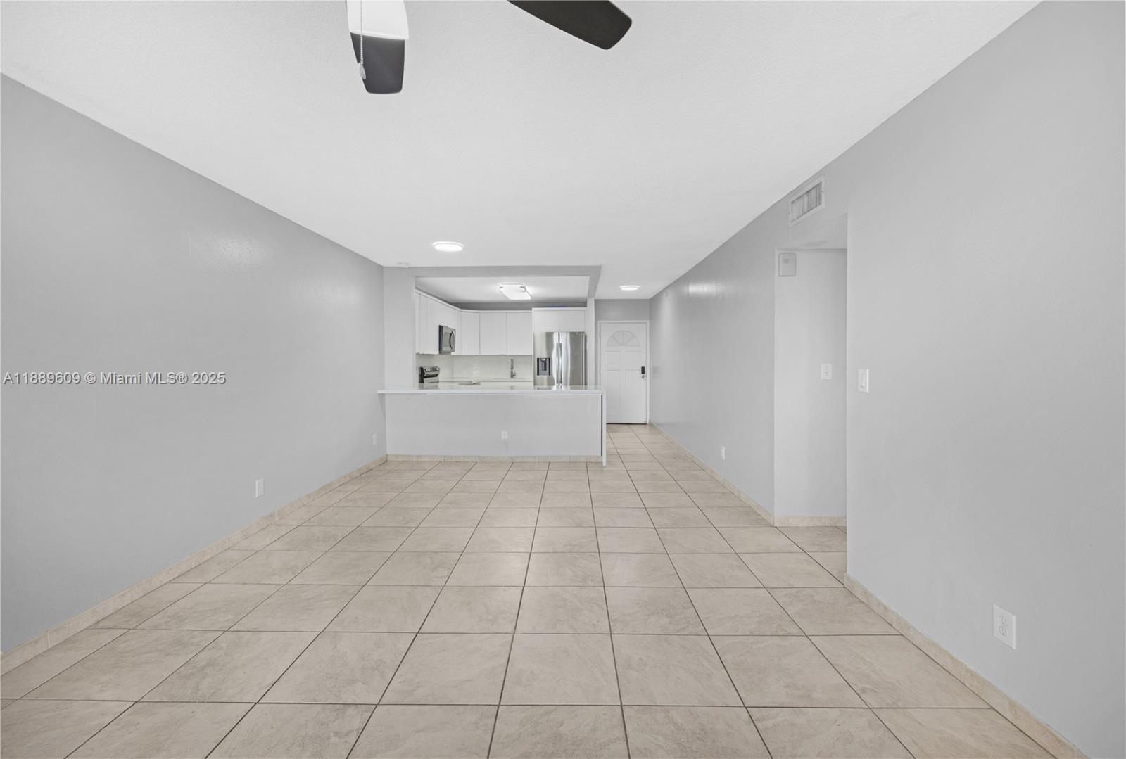 1750 West 46th Street, Unit 544 Hialeah, FL 33012 - Photo 12 of 46 a view of an empty room and window