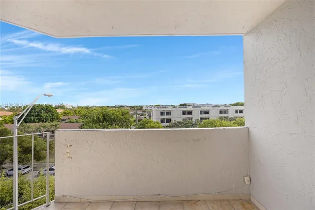a view of a balcony with an outdoor space