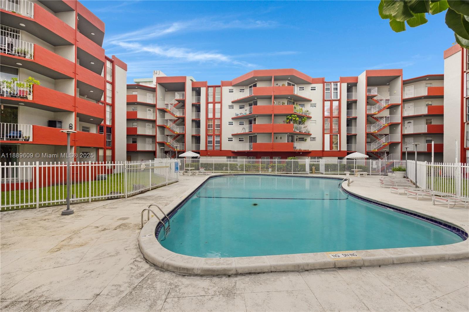 1750 West 46th Street, Unit 544 Hialeah, FL 33012 - Photo 30 of 46 a view of building with swimming pool and outdoor space