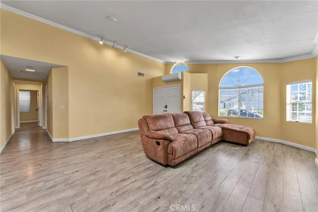 a living room with furniture and a large window