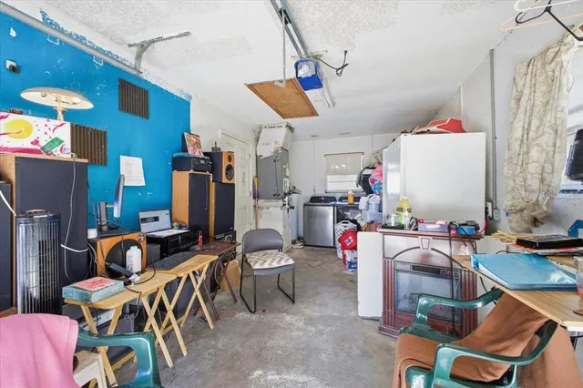 a view of a room with workspace and music instruments