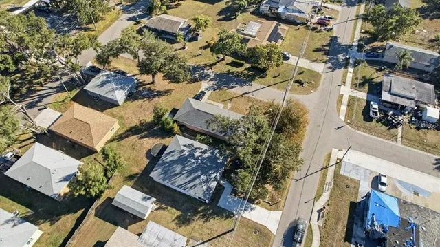 an aerial view of residential houses with outdoor space