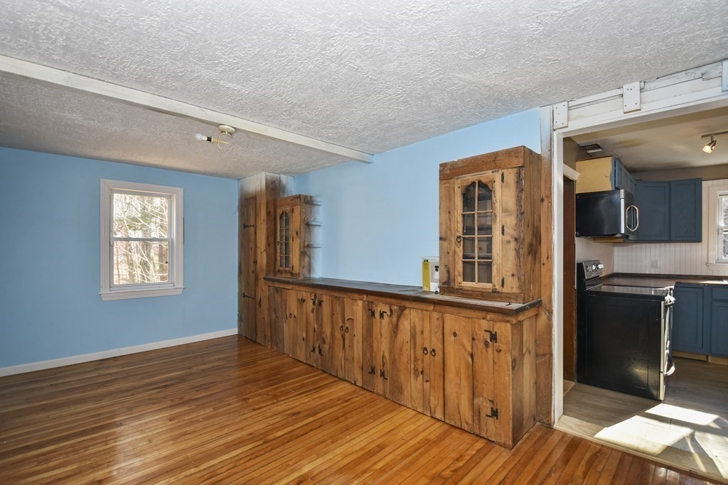 96 Ashby Road Ashburnham, MA 01430 - Photo 8 of 30 a view of empty room with wooden floor and fan