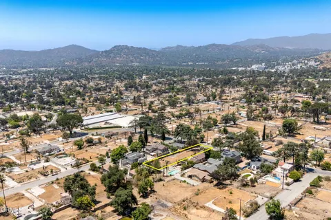 an aerial view of residential house and covered with snow